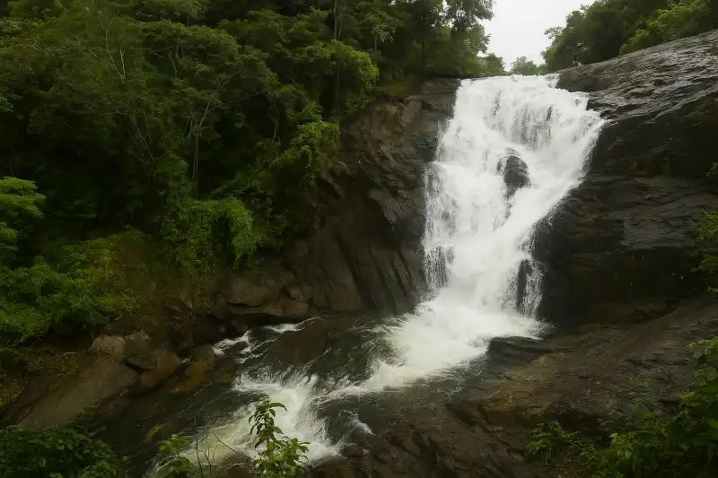 Peaceful view of Kanthanpara Waterfalls in Wayanad during the monsoon season.”