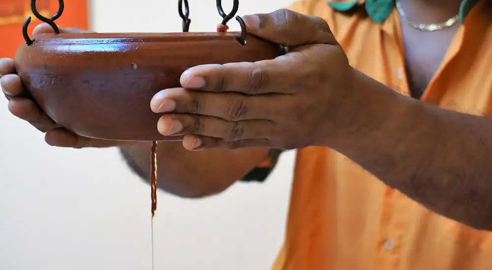 Relaxing ayurvedic massage session at Vythiri’s top resort spa