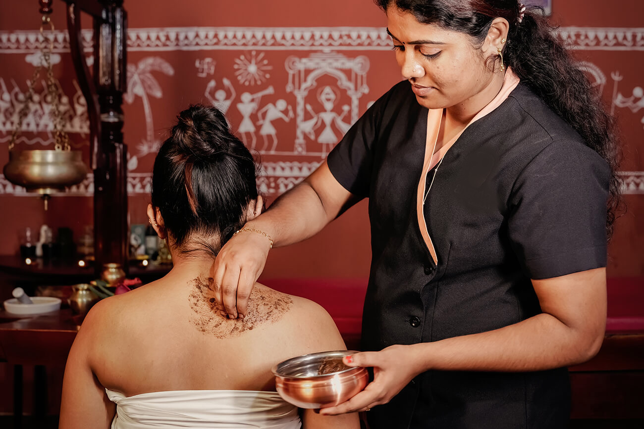 Traditional Ayurvedic therapy session at a wellness resort in Kerala
