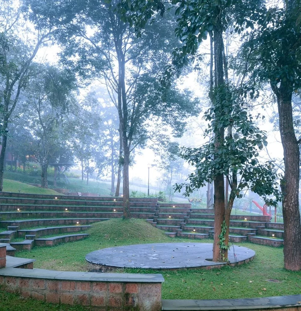 Lush green landscape surrounding Morickap Lords83 Resort in Wayanad, featuring scenic hills, tropical vegetation, and a peaceful natural atmosphere.