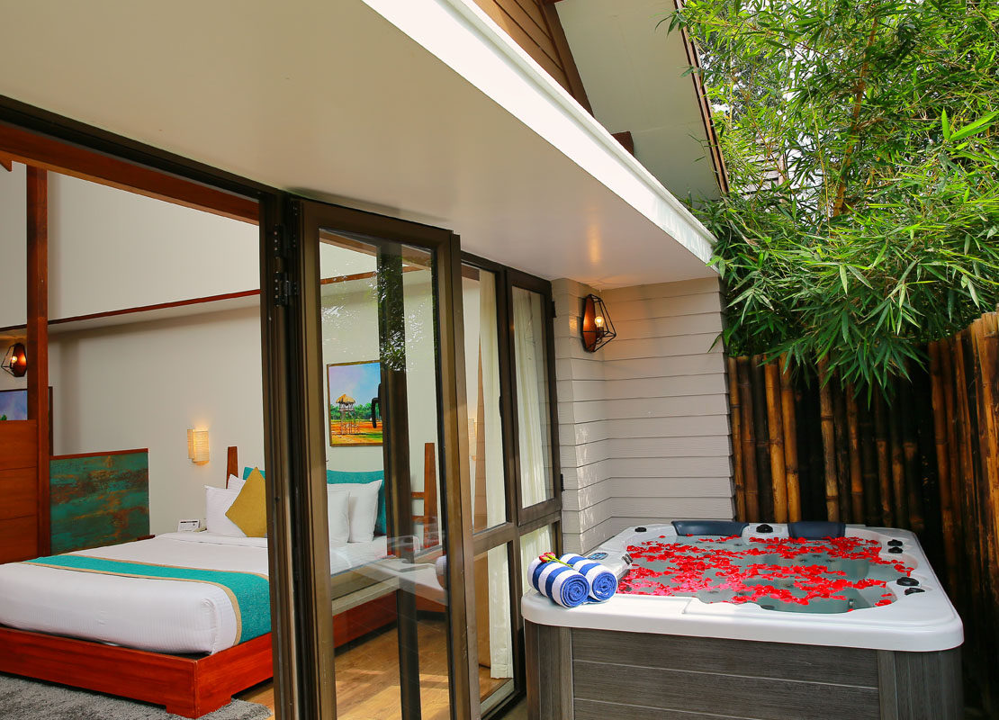 Jacuzzi Villa with private jacuzzi and bamboo fence at Morickap, a family resort in Wayanad